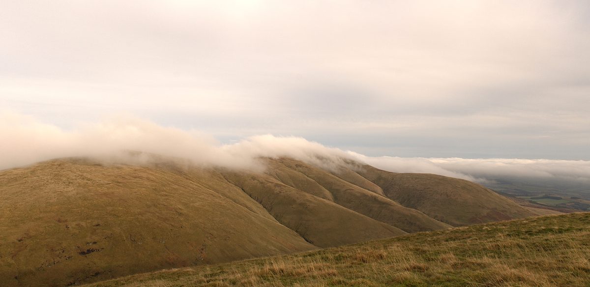 Fog wave over Whitewisp Hill